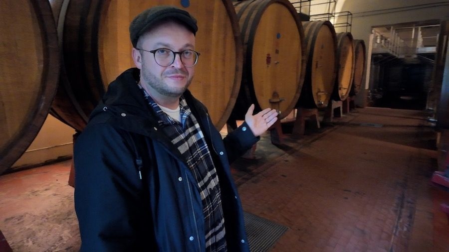 The author of the investigation pictured next to Dmitry Medvedev's wine barrels